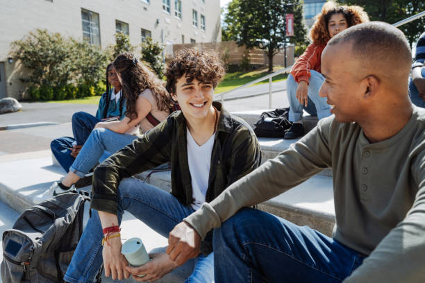 istock Group of diverse students in campus outdoors, talking and smiling 1724364950