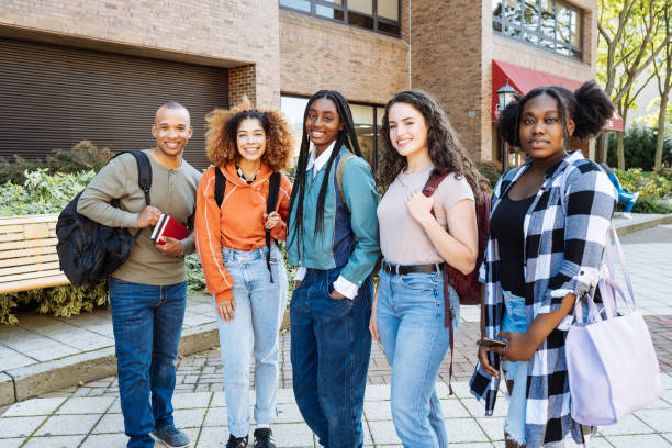istock Group of diverse multi ethnic students in campus outdoors looking at camera 1724367630