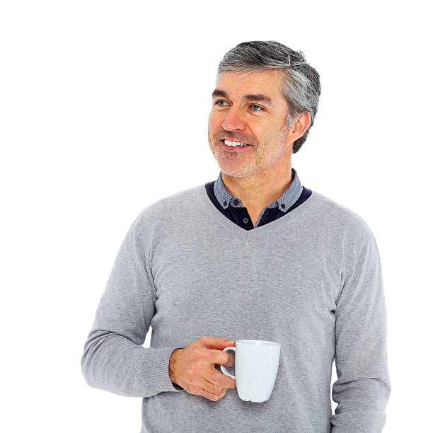 istock Smiling mature man with cup of coffee looking at copyspace 172436769