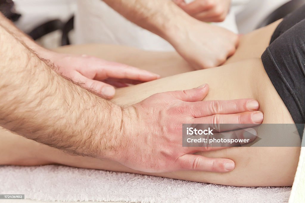 Massage Man receiving leg massage. 30-39 Years Stock Photo