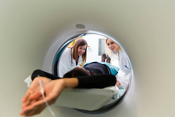 istock Young black woman waiting for CAT scan with contrast 172436963