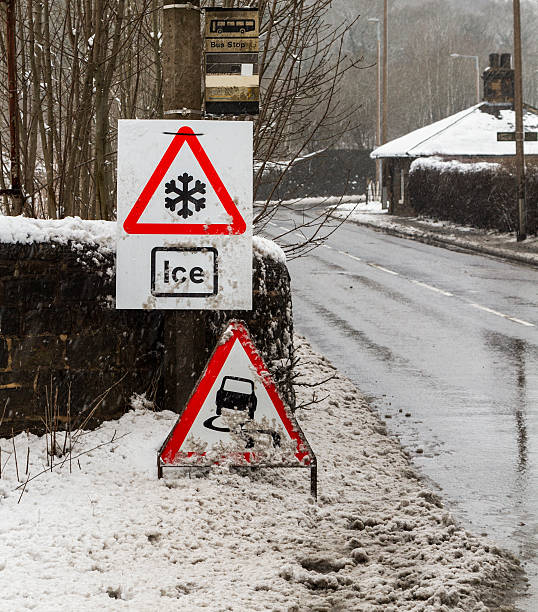istock Snow and ice road sign 172436988