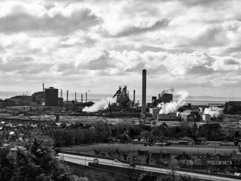 View of Port Talbot steelworks steaming factory towers.