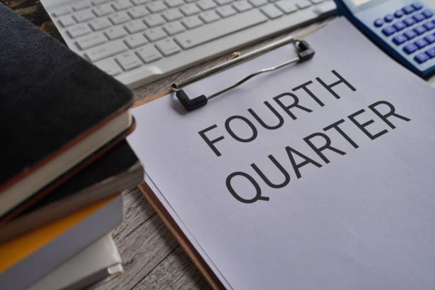 istock Close up image of paper clipboard with text FOURTH QUARTER. 1724371368