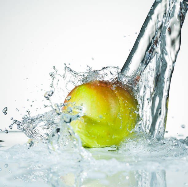 Water Splashing on a Fresh Green Apple