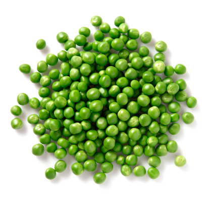 Pile of green peas on white background