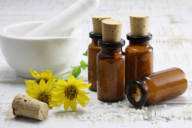 istock homeopathic arnica pills in brown bottles 1724376739