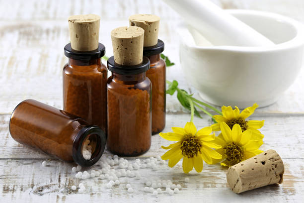 istock homeopathic arnica pills in brown bottles 1724376749