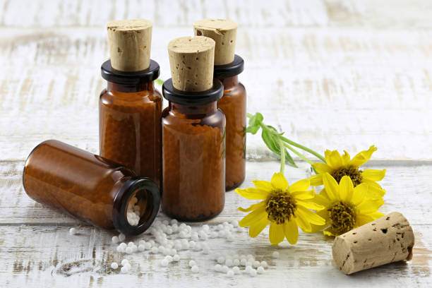 istock homeopathic arnica pills in brown bottles 1724376754
