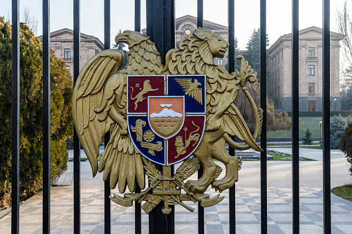 Yerevan, Armenia - 3 January, 2023: The state emblem of Armenia on a cast-iron fence around the National Assembly of Armenia (Parliament of Armenia).