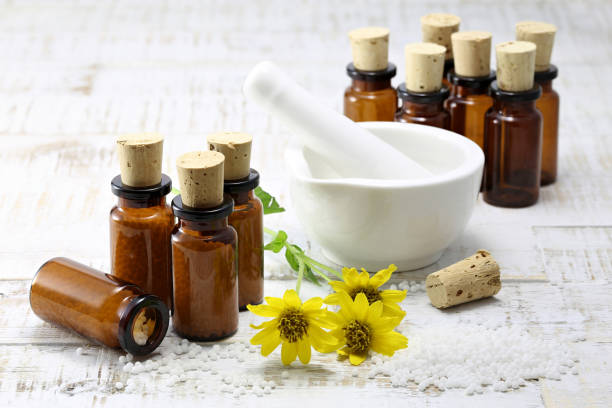 istock homeopathic arnica pills in brown bottles 1724377299