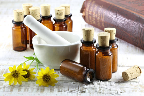 istock homeopathic arnica pills in brown bottles 1724377307