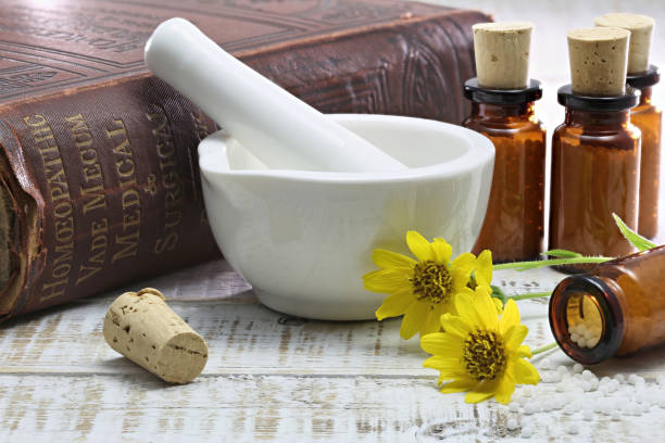 homeopathic arnica pills in brown bottles