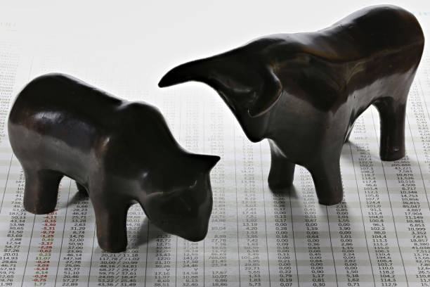 istock bull and bear on newspaper with stock quotes 1724378906
