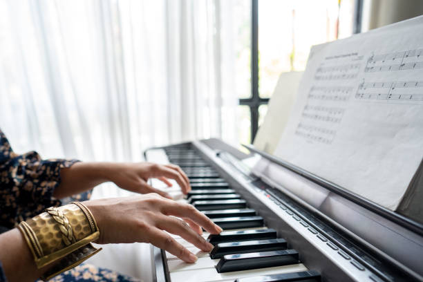 istock Close-up of a keyboardist performing synthesizer at home 1724378921