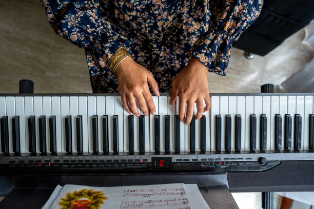 istock High angle view of a keyboardist performing synthesizer 1724378928