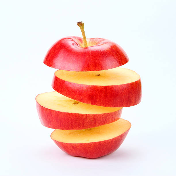 suspendido de manzana - apple red delicious apple studio shot fruit fotografías e imágenes de stock