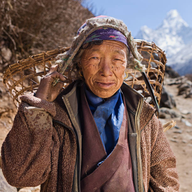 istock Old woman carrying basket 172438274