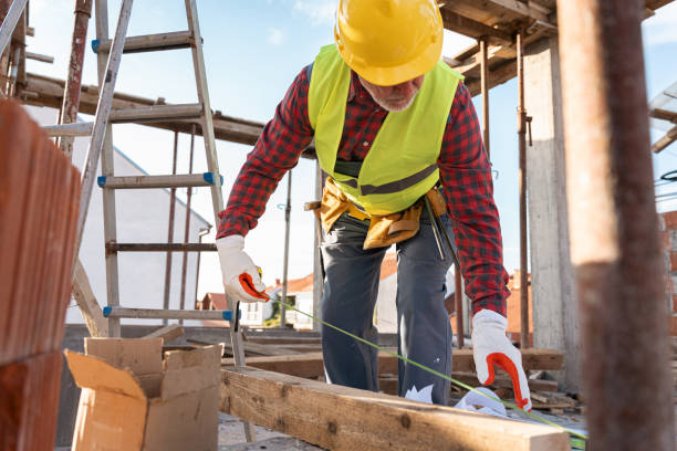 istock Senior Caucasian construction worker, measuring timber with tape measure 1724384408