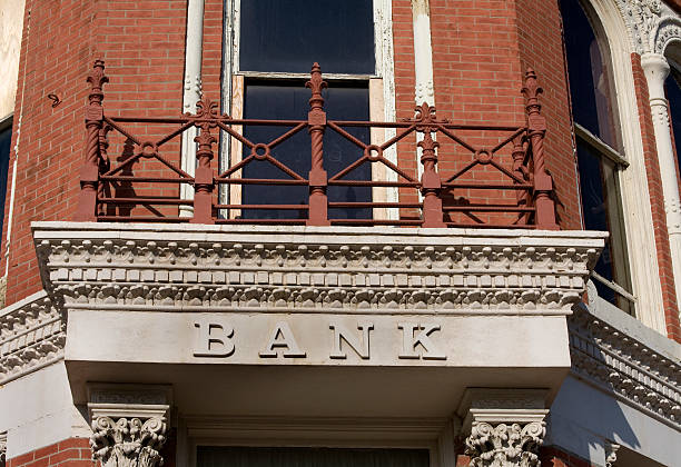 Low angle view of modern bank building in city