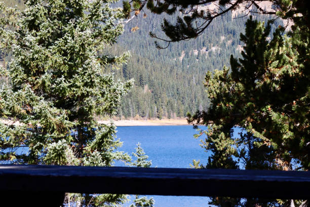 istock Picnic Table near Mountain Lake 1724385505