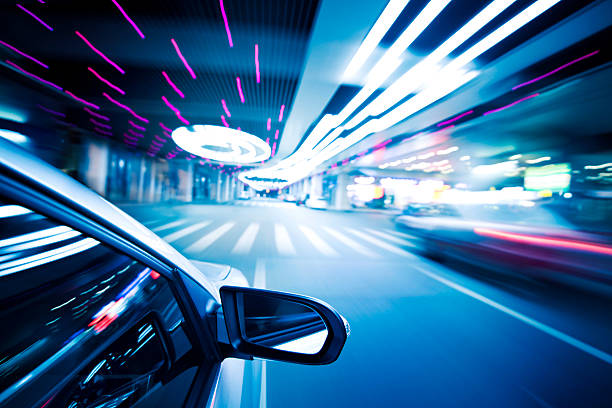 istock A car zooming by in night time traffic 172438637