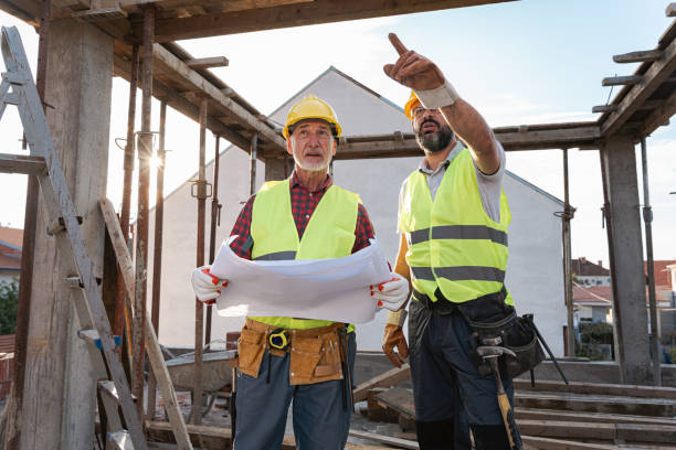 istock Caucasian architect and building contractor having an meeting about project on a construction site 1724387662
