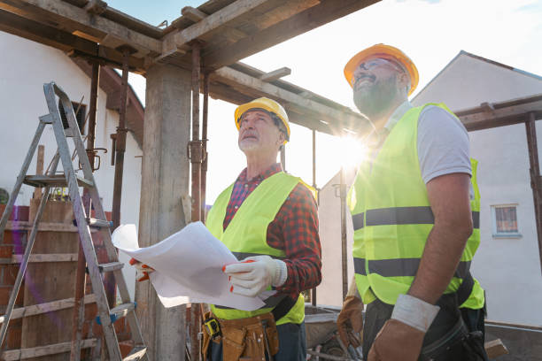 istock Caucasian architect and building contractor having an meeting about project on a construction site 1724387663
