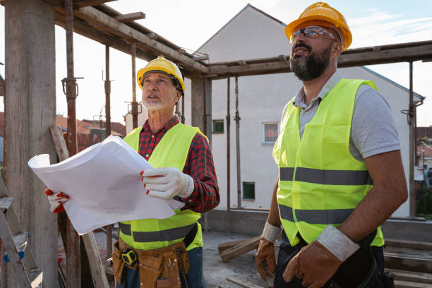 istock Caucasian architect and building contractor having an meeting about project on a construction site 1724387664