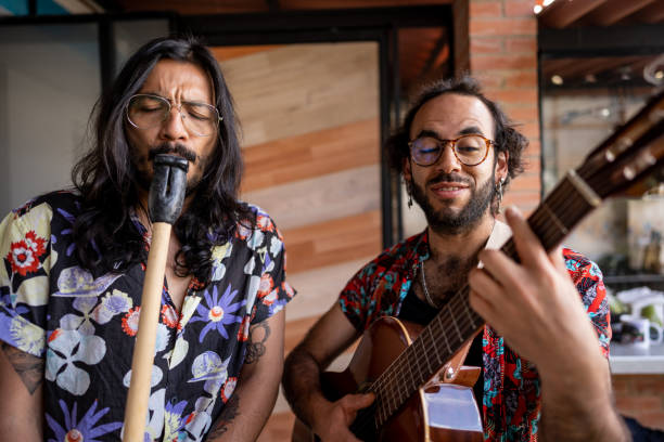 istock Friends playing guitar and flute at home 1724388187