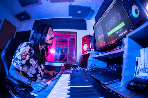 Producer making music or remix at music studio