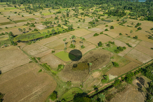 Cambodian landscape with air balloon shadow