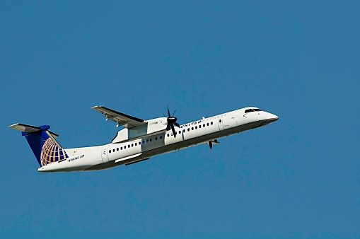 Image is intended for editorial use -  United Airlines Turboprop Commercial Passenger Aircraft Taking Off from Pearson Toronto