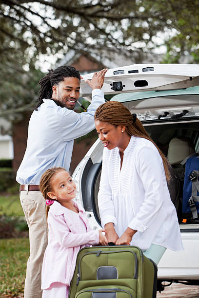 istock Family loading luggage into car 172439008