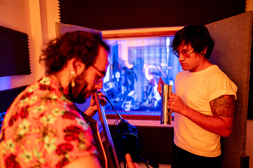 Musicians recording at music studio