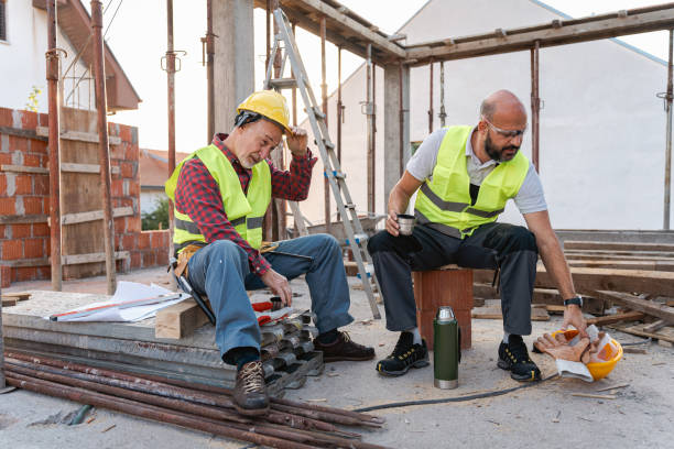istock Tired male Caucasian construction workers, having an break on a construction site 1724394794