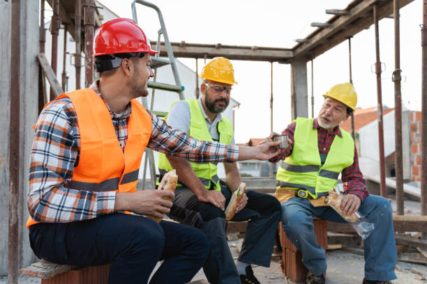 istock Caucasian architect, building contractor and engineer, having an lunch break on a construction site 1724398532