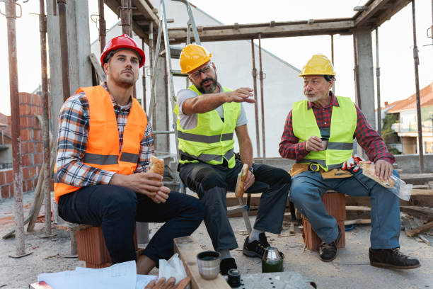 istock Caucasian architect, building contractor and engineer, talking during an lunch break on a construction site 1724398533