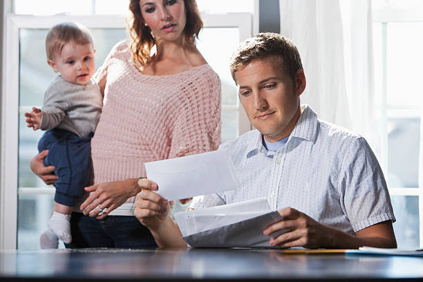 istock Mother and baby, father paying bills 172439985