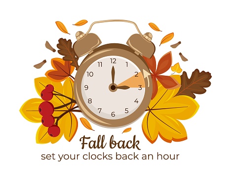 Daylight Saving Time Ends November 5, 2023. Alarm Clock Set To Clock Back One Hour on Background Autumn Foliage. WinterTime, Fall Back.