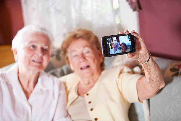 istock Elderly women photographing themselves 172440124