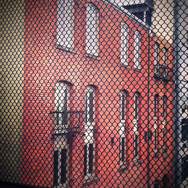 City Housing Buildings seen through chain link fence