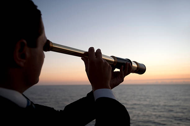 istock Businessman looking to the future with telescope 172440688