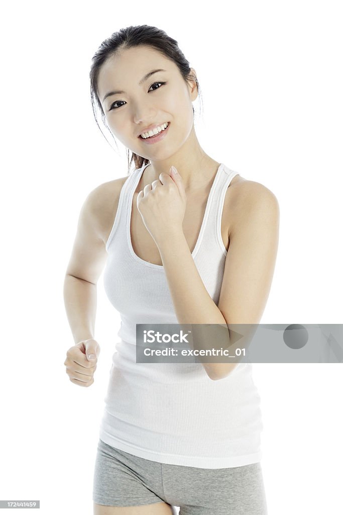 Attractive Asian sporty woman isolated on white background Pretty Asian woman wearing a sporty outfit isolated on a white background 20-29 Years Stock Photo