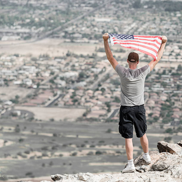 istock Man with us flag against phoenix panorama 172441555