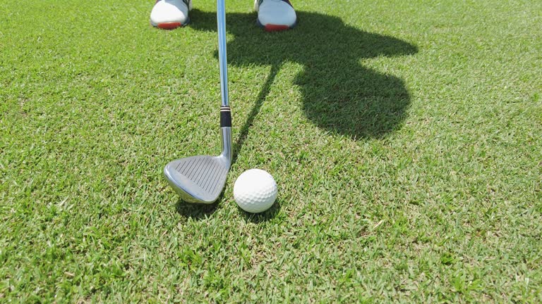 golfer hitting golf ball at golf course using club and driver.sport and healthy concept.