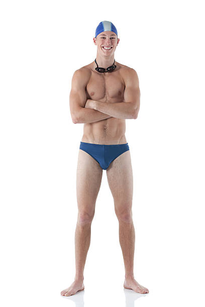sorridente homem natação em pé com os braços cruzados - swimming male isolated swimming goggles imagens e fotografias de stock