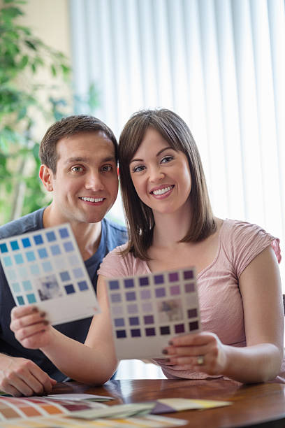 istock Couple Comparing Color Swatches At Table 172441774