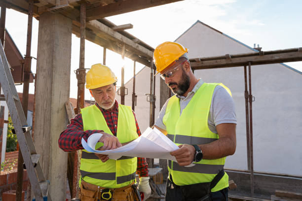 istock Caucasian architect and building contractor having an meeting about project on a construction site 1724421094