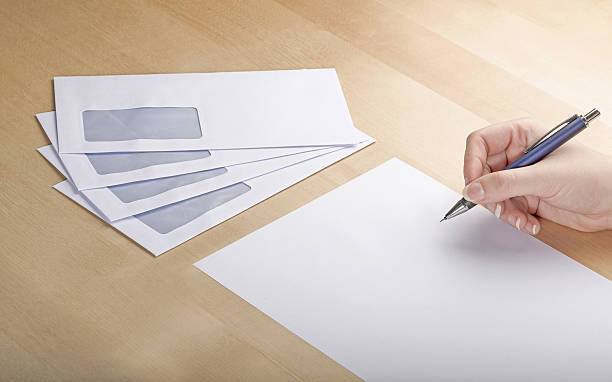 istock Writing a letter on wooden table 172442132